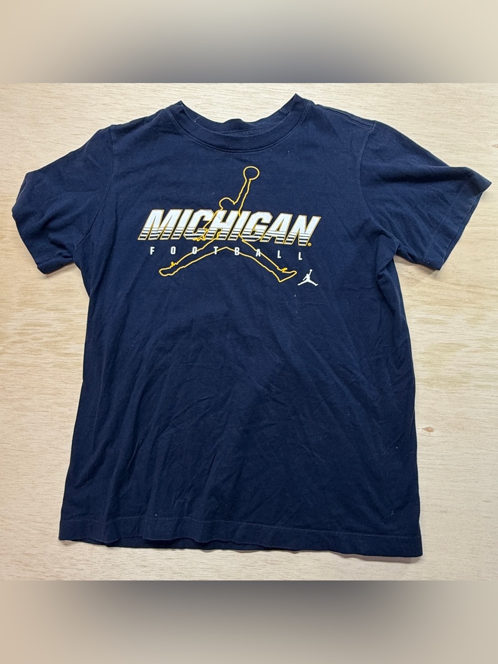 Nike Jordan Navy Youth Jumpman Michigan Football Logo Tee with Gold Accent, YL